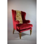 A 19th Century Wing Armchair with Gilded Tapering Front Supports