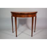 A Mahogany String Inlaid Georgian Games Table with Beize Top and Supported on Tapered Legs. 84cms