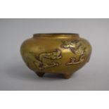 A 19th Century Chinese Bronze Censer on Three Feet, The Body Decorated in Relief with Dragons,