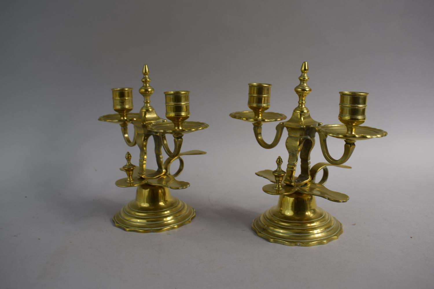 A Pair of Late 19th Century Brass Two Branch Bedchamber Candlesticks with Finger Ring and Thumb