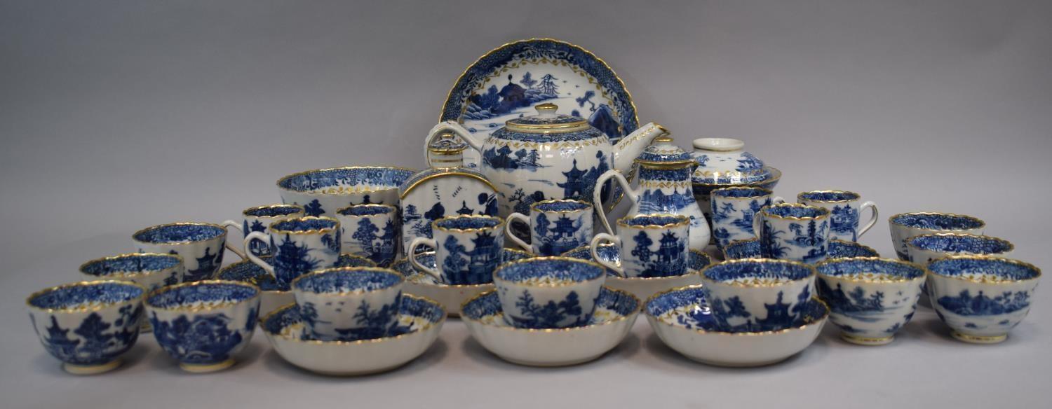 A Chinese Export Style Blue and White Pagoda Pattern Tea Set with Gilt Highlights Comprising Tea