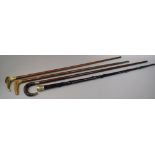 A Collection of Two Horn Handled and One Bone Handled Walking Sticks Together with a White Metal