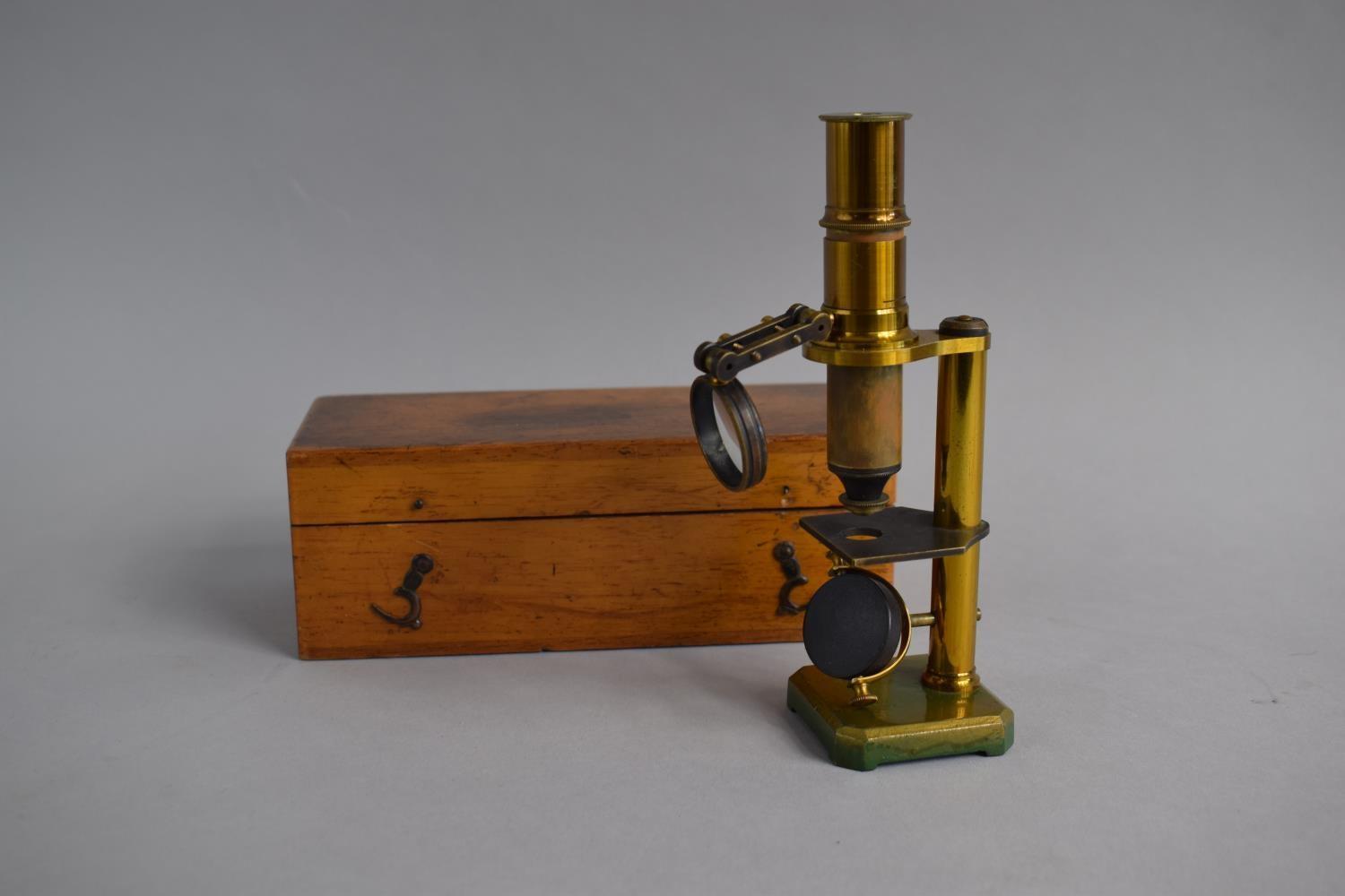 A Wooden Cased Brass Field Microscope with Condenser Lens