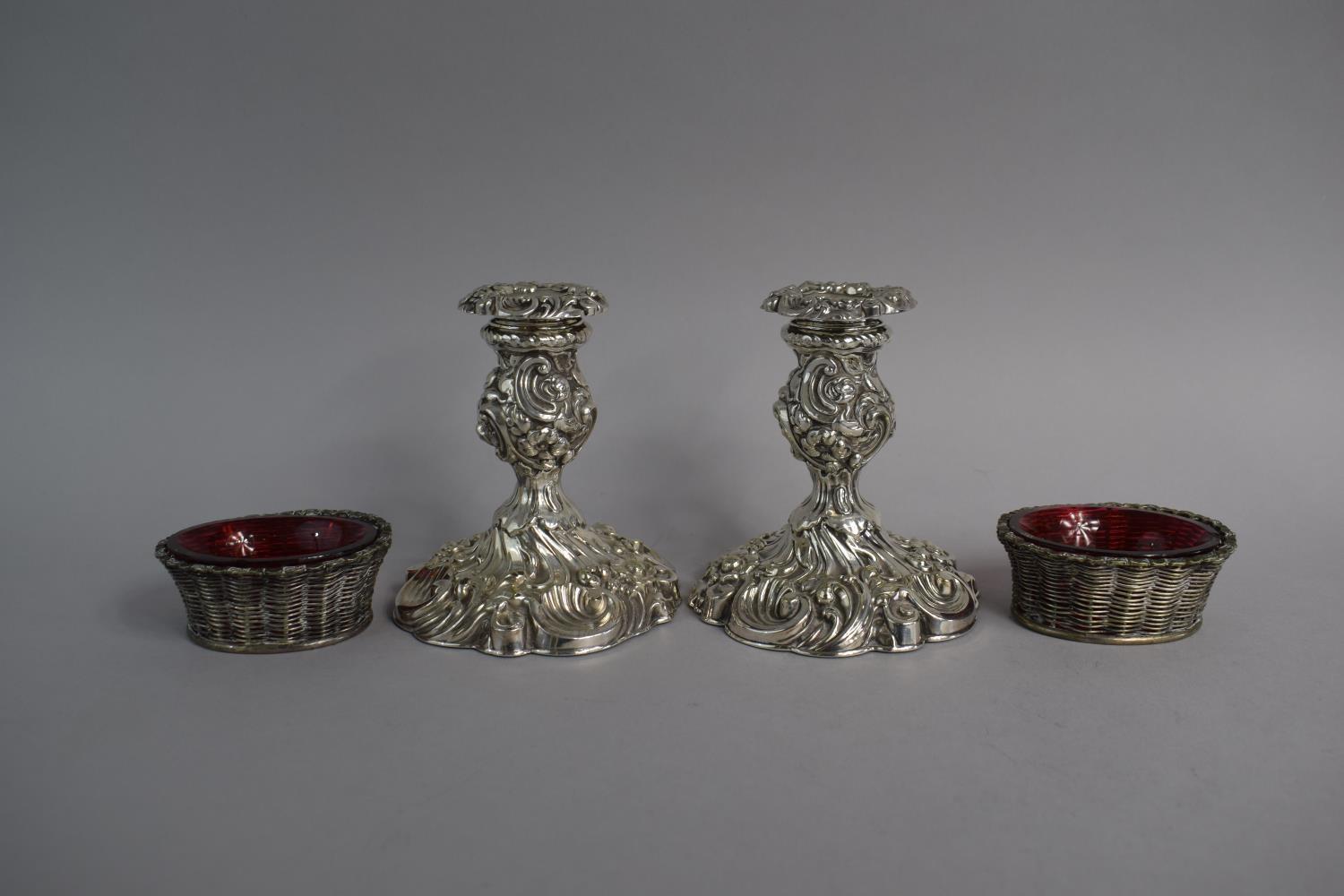 A Pair of Silver Plated Rococo Style Candlesticks Together with a Pair of Silver Plated Salts in the