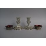 A Pair of Silver Plated Rococo Style Candlesticks Together with a Pair of Silver Plated Salts in the