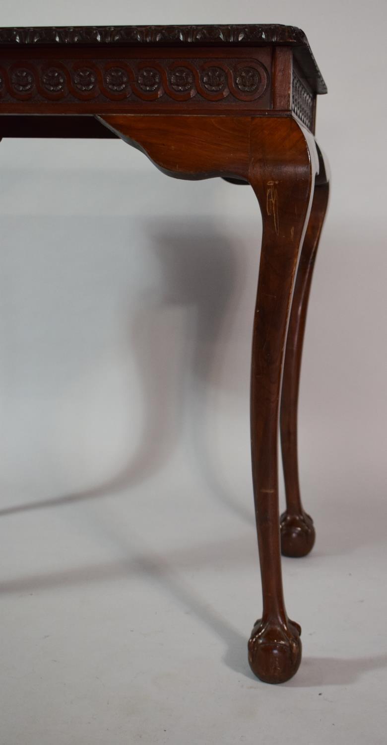 A Mahogany Silver Table with Carved Border set on Cabriole Legs culminating in Claw and Ball Feet/ - Image 3 of 5