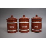 A Set of Three French Enamelled Metal Storage Jars, 18cm High