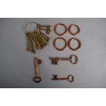 A Collection of 19th Century and Later Keys to Include Three Copper Examples and Twelve Brass