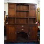 An Edwardian Oak Arts and Crafts Influenced Dresser with Two Centre Drawers Over Open Display