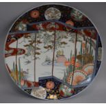 A Japanese Imari Circular Charger with Screen and Pond Decoration Featuring Ducks and Butterflies,