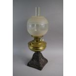 A Late Victorian Pierced Iron Oil Lamp with Brass Reservoir, Chimney and Shade