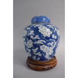 A Chinese Blue and White Ginger Jar and Cover with Prunus Decoration and Four Character Mark to