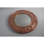 A Keswick School of Industrial Art Circular Copper Framed Mirror with Rounded and Foliate