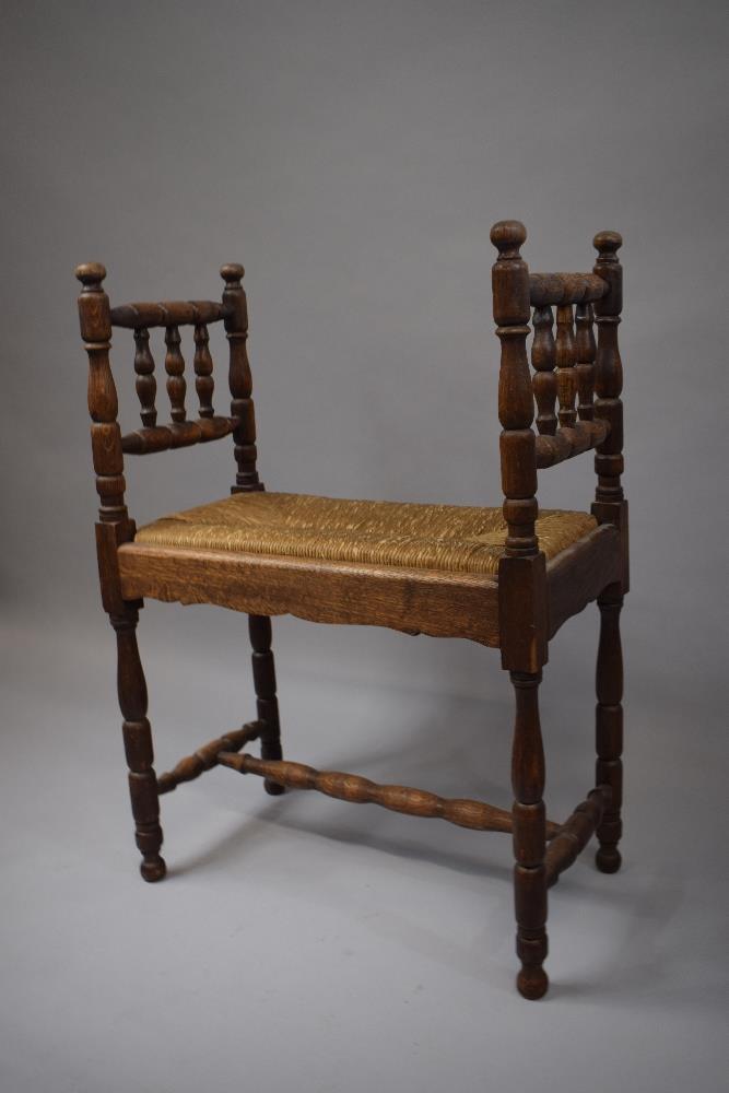 An Oak Framed Rush Upholstered Window Seat/Stool of Small Proportions with Turned Supports and