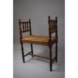 An Oak Framed Rush Upholstered Window Seat/Stool of Small Proportions with Turned Supports and