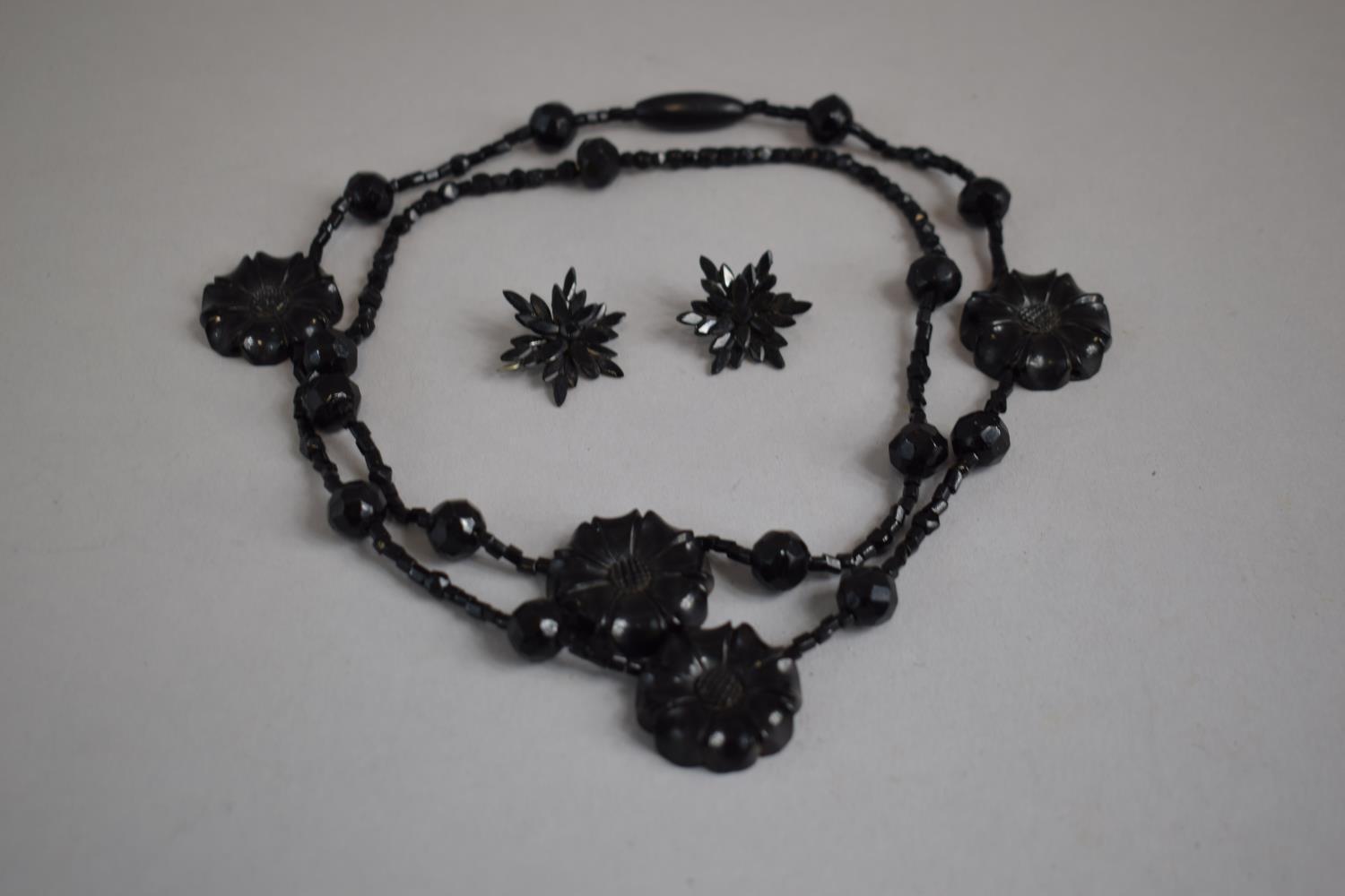 A Victorian Jet Necklace (Restrung) Having Four Floral Beads interspersed amongst Faceted and