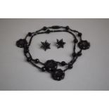 A Victorian Jet Necklace (Restrung) Having Four Floral Beads interspersed amongst Faceted and