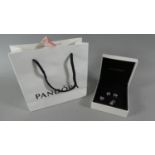 A Boxed Collection of Four Pandora Charms with Original Bag