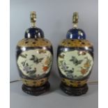 A Pair of Oriental Ceramic Table Lamps on Pierced Wooden Stands, 43cm High