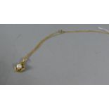 A 9ct Gold Pearl Mounted Pendant and Chain, 3.5g