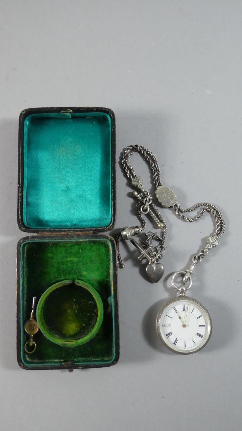 A Silver Cased Continental Ladies Pocket Watch with Watch Chain, Charms and Key
