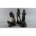 A Set of Three Bronze Effect Figural Ornaments