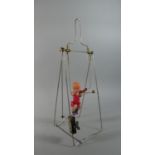 A Vintage Clockwork Automaton Gymnast Toy