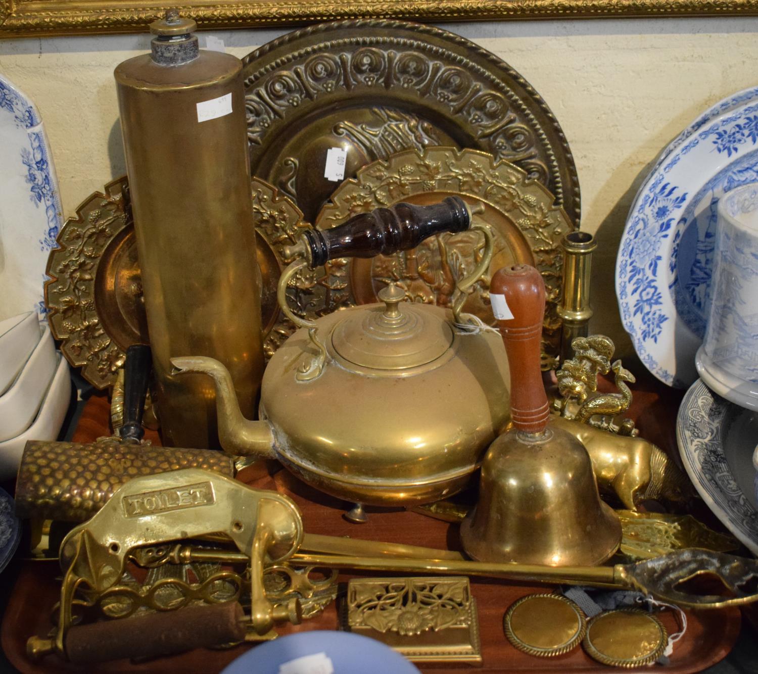 A Tray of Brassware to Include Bell, Amber Glass Style Handled Kettle, Brass Toilet Roll Holder,
