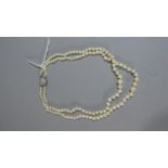 A Two String Pearl Necklace with Silver Clasp