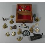 A Far Eastern Wooden Box Containing Collection of Reproduction and Original Military Badges etc