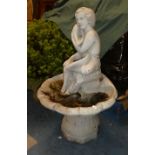 A Reconstituted Stone Garden Water Feature in the Form of Seated Cherub with Shells, 88cm High