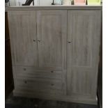 A Matching Bedroom Unit with Panelled Doors to Two Shelved Cupboards and Two Long Drawers, 122cm