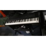 A Roland EP.7 Digital Piano with Stand and Stool