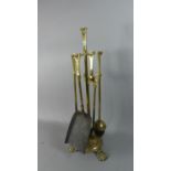 A Brass Fire Companion Set on Three Claw Feet, 55cm high