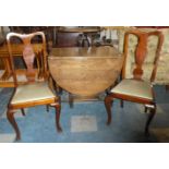 An Oak Drop Leaf Dining Table and Two Mahogany Queen Anne Style Dining Chairs