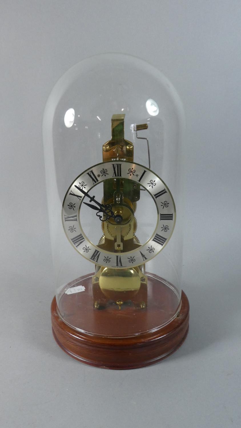 A Reproduction Skeleton Style Clock, Glass Dome, Bell Detached