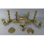 A Collection of Brass Ornaments, Two Pairs of Brass Candlesticks and a Brass Carriage Clock (