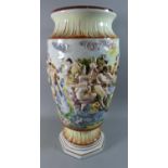 A Large Naples Capodimonte Vase Decorated in Relief Bacchus Scene, 54cm high