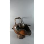 A Late 19th Century Copper Helmet Shaped Coal Scuttle with Matching Shovel, 56cm Long