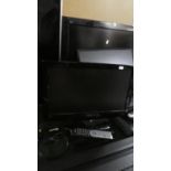 A Hitachi 18" TV with Remote and DVD Player