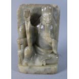 A Carved Soapstone Study of Seated Immortal Raising Cup, 17.5cm High