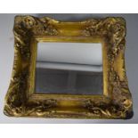 A Reproduction Heavily Moulded Gilt Framed Bevel Edged Rectangular Wall Mirror, Some Loss