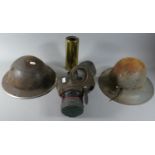 Two WWII Helmets, Gas Mask and a Shell Case