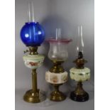 A Collection of Three Oil Lamps, One Converted to Electricity