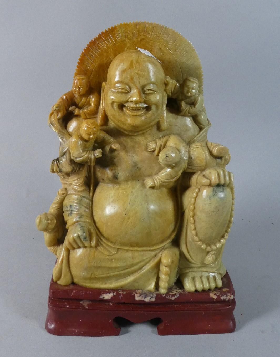 A Carved Soapstone Figure of Seated Smiling Buddha with Four Attendants, 24cm High