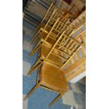 A Set of Four Gilt Sprayed Faux Bamboo Metal Chairs