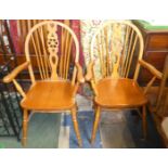 A Pair of Wheel Back Armchairs with Pierced Splats