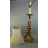 An Ornate Gilt Tall Table Lamp and Shade on Tripod Base, Lamp 96cm high