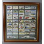 A Framed Set of Cigarette Cards, Planes, Trains, Bikes, Boats and Cars etc