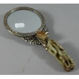 A Reproduction Chinese Hand Mirror with Faux Jade Handle and Back Decorated with Dragons Chasing